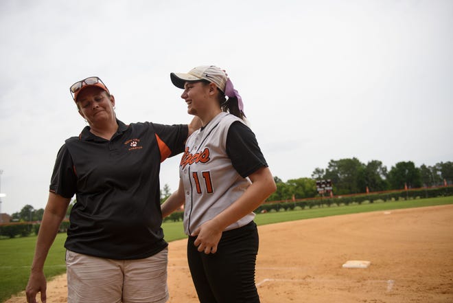 Kellie Aldridge talks with her daughter Payton, who pitches for South View High School. Payton's career under her mom's coaching ends this year. [Melissa Sue Gerrits/The Fayetteville Observer]