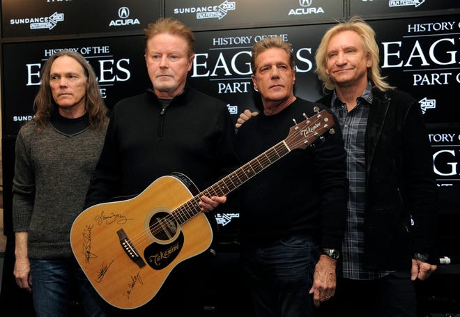 In this Jan. 19, 2013 file photo, members of the Eagles, from left, Timothy B. Schmit, Don Henley, Glenn Frey and Joe Walsh pose with an autographed guitar after a news conference at the 2013 Sundance Film Festival, in Park City, Utah. The band sued the owners a Mexican hotel on May 1, 2017, claiming it’s capitalizing off the band’s hit, “Hotel California,” even though it has nothing to do with the song. (Photo by Chris Pizzello/Invision/AP, File)