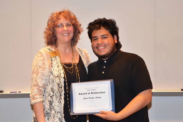 Jaime Peralta-Cornejo (right) of Waukee receives an Award of Distinction from DMACC Sociology Professor Hazel Hull. PHOTO SUBMITTED TO DCN