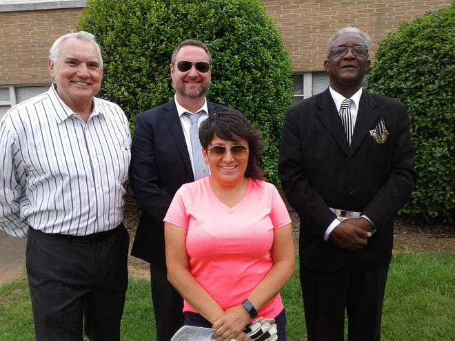 John Cantrell with City Manager Kevin Krouse, the Rev. Thomas Gillespie of Hebron Baptist Church, and Yvette Broussard of Lowell Parks and Recreation at a National Day of Prayer event in Lowell on Thursday. [PHOTO BY LISA RUDISILL/SPECIAL TO THE GASTON GAZETTE]