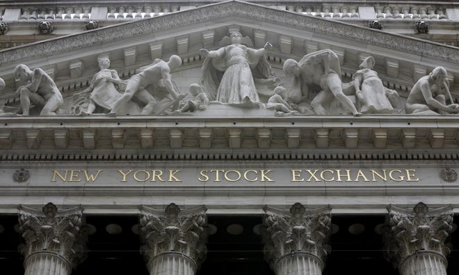 This Oct. 4, 2014, file photo, shows the facade of the New York Stock Exchange. Stocks are modestly higher in early trading on Wall Street, Friday, May 5, 2017, after the government reported a pickup in hiring in April. THE ASSOCIATED PRESS