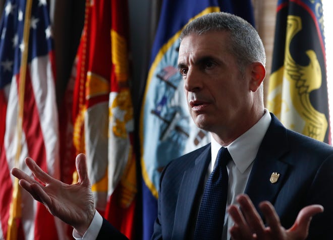 In this photo taken April 19, 2017, Andrew Traver, director of the Naval Criminal Investigative Service (NCIS) speaks during an interview at Marine Corps Base Quantico, in Quantico, Va. In an office at the Marines’ Quantico base outside Washington, about 20 investigators sit elbow to elbow, staring into their computers as images of naked men and women flash across the screens. The objective of all this disturbing sleuth work is to root out the depths of a nude-photo sharing scandal that has rocked the Corps, embarrassed its leaders and spread to other military services. And the sheer weight of the objectionable material is daunting. (AP Photo/Carolyn Kaster)