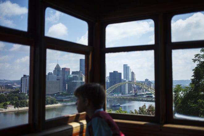 Downtown Pittsburgh is seen through the window of the Duquesne Incline in Pittsburgh, Penn. The incline opened in 1877 and was restored in 1963. [JONATHAN ELDERFIELD/THE ASSOCIATED PRESS]