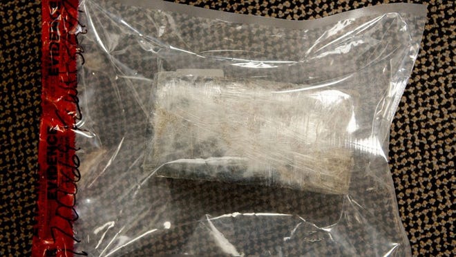 This brick, appearing to marijuana, was discovered by a Palm Beach couple Tuesday May 2, 2017 on the beach in the 3400 block of South Ocean Boulevard. (Meghan McCarthy / Daily News)
