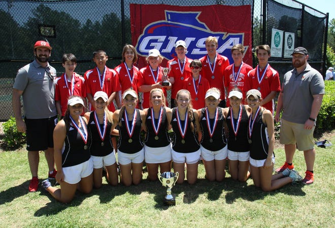 The North Oconee Lady Titans and Titans after the finals of the Class AAAA state tournament on Saturday in Jonesboro. The Lady Titans defeated St. Pius X to win the state championship and the Titans lost to Marist to finish as state runner-up (photo by Matthew Caldwell)
