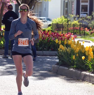 Emily Oren runs toward the finish line at the Tulip Time Run on Saturday, May 6. [Dan D'Addona/Sentinel staff]