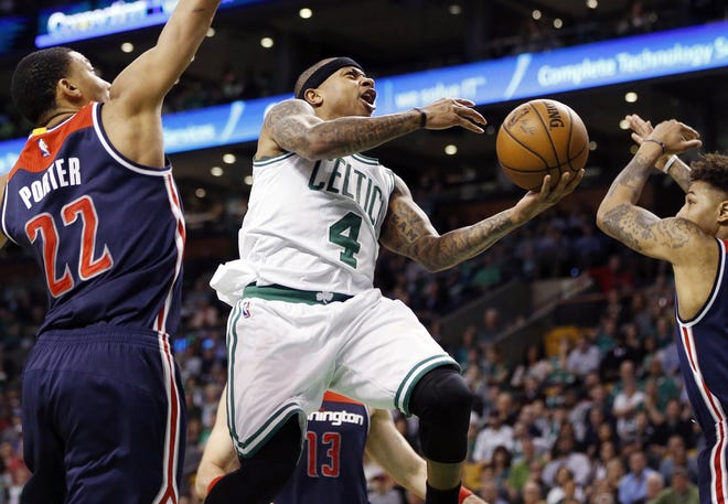 Celtics' guard Isaiah Thomas goes up for a shot during the second quarter of the Celtics overtime win over the Washington Wizards in Game 2 of their playoff series last Tuesday. [AP Photo/Michael Dwyer]