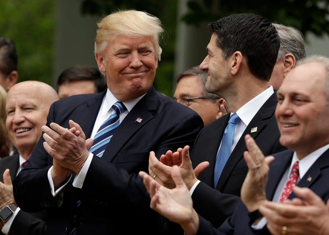 President Donald Trump talks with House Speaker Paul Ryan of Wis., in the Rose Garden of the White House in Washington, Thursday, May 4, 2017, after the House pushed through a health care bill. House Majority Whip Steve Scalise of La. is at left, and House Ways and Means Committee Chairman Rep. Kevin Brady, R-Texas is at right. (AP Photo/Evan Vucci)
