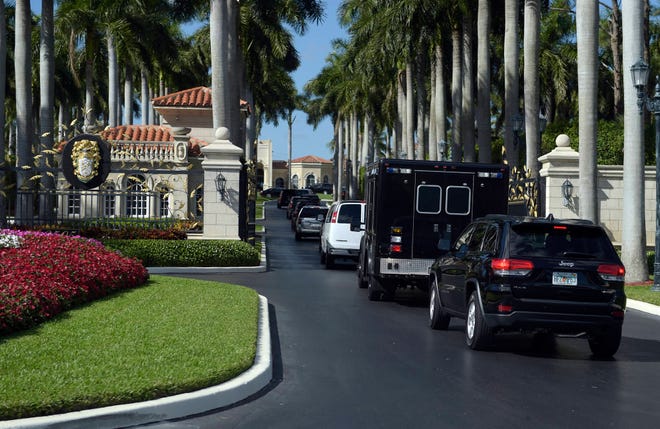In this Feb. 11, 2017, file photo, the motorcade with President Donald Trump and Japanese Prime Minister Shinzo Abe arrives at Trump International Golf Club in West Palm Beach, Fla. The president was in Mar-a-Lago for that weekend and had no public events on his schedule. (AP Photo/Susan Walsh, File)