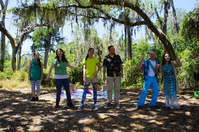 The group Actors Reaching Out perform under the trees at Lake Louisa State Park Saturday at the Nature Fest. [LINDA CHARLTON / CORRESPONDENT]
