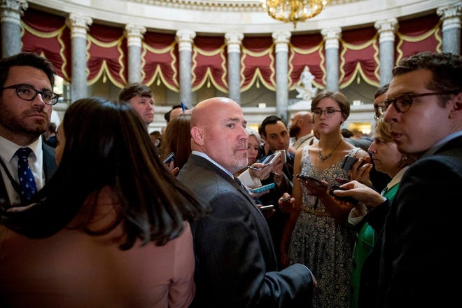 Andrew Harnik/Associated Press Rep. Tom MacArthur, R-N.J., center, pauses while speaking to members of the media off the House Chamber on Capitol Hill in Washington on Thursday after the Republican health care bill passed in the House.