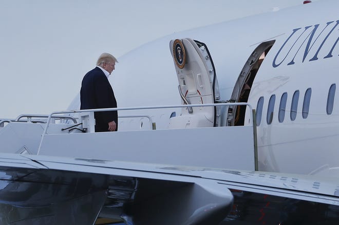 President Donald Trump boards Air Force One prior to his departure from Morristown Municipal Airport, Sunday, May 7, 2017, in Morristown, N.J. Trump returned to Washington after spending the weekend at his New Jersey golf course. THE ASSOCIATED PRESS
