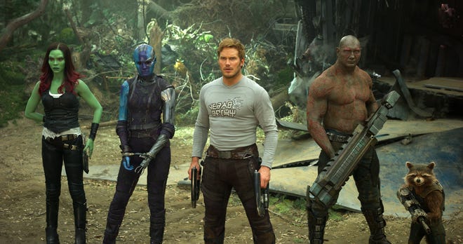 This image shows Zoe Saldana, from left, Karen Gillan, Chris Pratt, Dave Bautista and Rocket, voiced by Bradley Cooper, in a scene from, "Guardians Of The Galaxy Vol. 2." (Marvel Studios)
