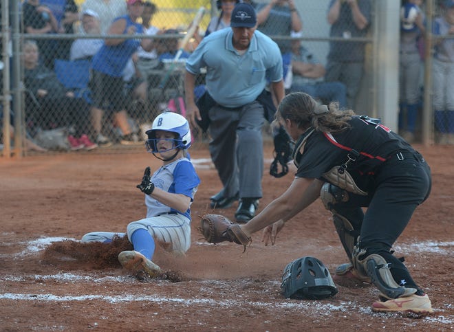 Byrnes' Molly Mattas slides safely into home as Boiling Springs catcher Logan Webb is late with the tag during Monday night's 5A playoff game. [JOHN BYRUM/Spartanburg Herald-Journal]