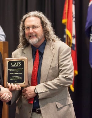 Dan Maher, a Lena native who is now associate professor of anthropology and sociology at the University of Arkansas – Fort Smith, recently was recognized with the Research, Scholarship and Creative Activities Award during a faculty appreciation ceremony at the university. [PHOTO PROVIDED]
