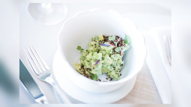 Avocado tartare with sesame, yuzu and puffed red quinoa is a favorite at Chez L’Epicier.