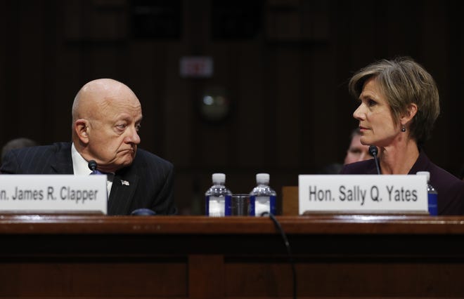 Former acting Attorney General Sally Yates, right, and former National Intelligence Director James Clapper, look to each other on Capitol Hill in Washington, Monday, May 8, 2017, while testifying before the Senate Judiciary subcommittee on Crime and Terrorism hearing: "Russian Interference in the 2016 United States Election." THE ASSOCIATED PRESS