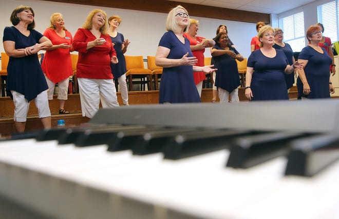 The Harmony Shores Chorus practices at First United Methodist Church in Panama City on a recent Tuesday. Watch videos of the group at newsherald.com. [ANDREW WARDLOW/THE NEWS HERALD]