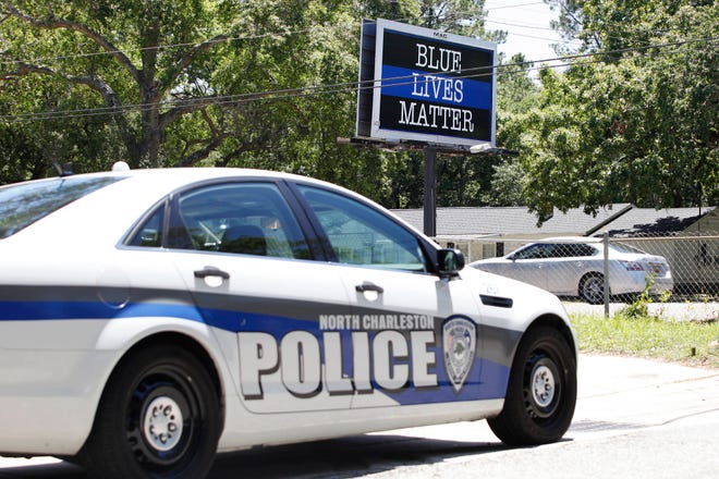 In this Monday, May 8, 2017, photo, a “Blue Lives Matter” billboard is shown on Remount Road in North Charleston, S.C. Days after a white former South Carolina police officer pleaded guilty to a civil rights charge in the 2015 death of an unarmed black man who ran from a traffic stop the billboard was installed on the road where the shooting happened. (Andrew Knapp/The Post And Courier via AP)