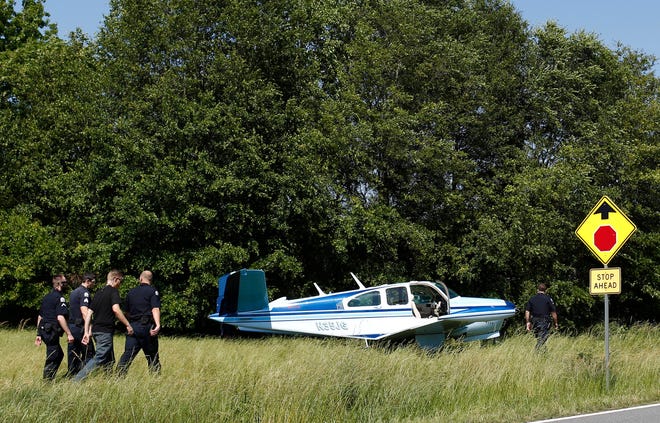 This 1963 Beechcraft Bonanza single-engine airplane was forced to make an emergency landing after losing power shortly after takeoff from Athens-Ben Epps Airport on Tuesday afternoon. No one was injured in the incident, in which the pilot and a passenger were aboard the aircraft. University of Georgia police responded to the scene, near a UGA livestock arena off South Milledge Avenue near Whitehall Road. (Photo/Joshua L. Jones, Athens Banner-Herald)