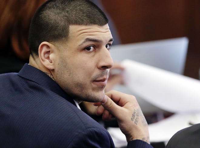 In this March 15, 2017, file photo, Defendant Aaron Hernandez listens during his double murder trial in Suffolk Superior Court, in Boston. A judge is set to hear arguments in a push by lawyers for former NFL star Aaron Hernandez to erase his conviction in a 2013 murder. The former New England Patriots tight end hanged himself in his prison cell April 19 while serving a life sentence in the killing of semi-professional football player Odin Lloyd. THE ASSOCIATED PRESS