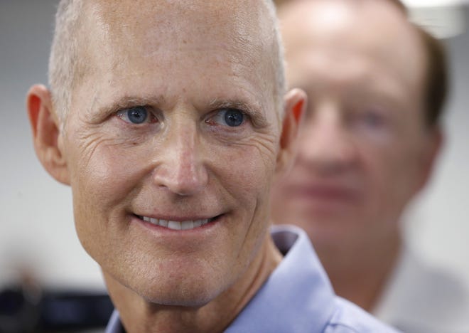 Florida Gov. Rick Scott said Tuesday that the tourism industry, which is tied to one in every six Florida jobs, could also be on shaky ground because of the budget approved by the Florida Legislature on Monday night. [AP Photo / Wilfredo Lee, File]