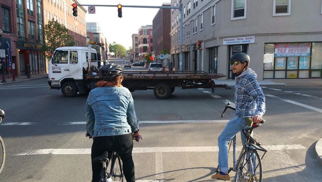 Bicyclists ride down Main Street in downtown Brockton during the 3rd annual Bike to Work Day in Brockton in 2016.