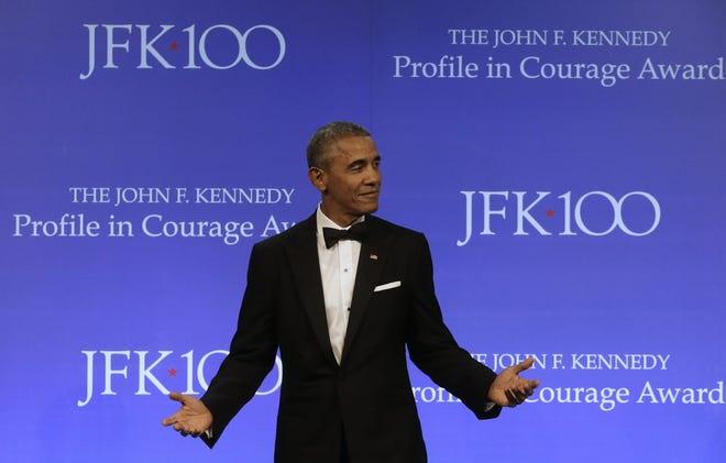 In this May 7, 2017, file photo, former President Barack Obama walks toward a podium to address an audience after being presented with the 2017 Profile in Courage award during ceremonies at the John F. Kennedy Presidential Library and Museum. Former President Barack Obama is starting to define his new role in the age of Donald Trump. After dropping out of sight for a pair of glamorous island getaways, Obama is emerging for a series of paid and unpaid speeches, drawing sharp contrasts with Trump even as he avoids saying the new presidentþÄôs name. THE ASSOCIATED PRESS