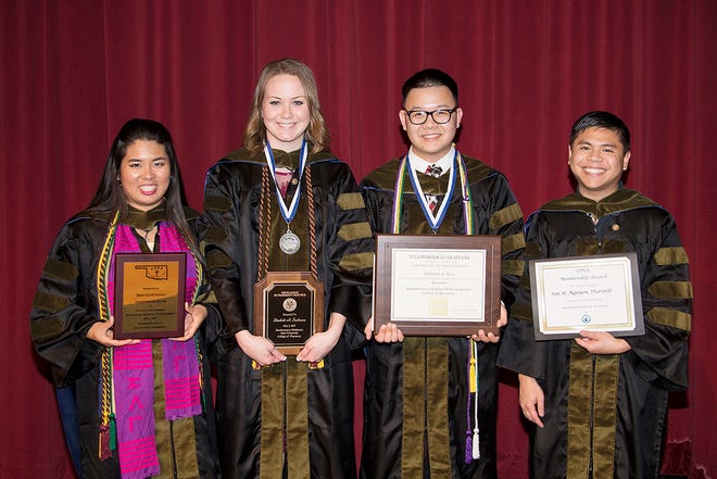 Southwestern Oklahoma State University College of Pharmacy seniors were honored at commencement and graduate recognition ceremony held on the Weatherford campus. Oklahoma City students receiving awards included, from left, Patra Kositchaiwat, Elizabeth A. Sandmann, Johnathan P. Tran and Son H. Nguyen. [Photo provided]