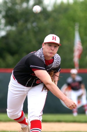 TIMES-REPORTER PAT BURK

Braden Mast of Hiland delivers to a Monroe Central batter Tuesday at Hiland.