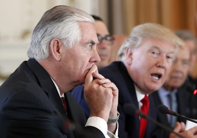 Secretary of State Rex Tillerson, left, listens as President Donald Trump speaks during a bilateral meeting with Chinese President Xi Jinping at Mar-a-Lago, Friday, April 7, 2017, in Palm Beach.