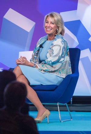U.S. Department of Education Secretary Betsy DeVos reacts as she speaks to the crowd at the ASU + GSV Summit at the Grand America Hotel in Salt Lake City, Tuesday, May 9, 2017. DeVos is reiterating her push for school choice during an annual education technology conference, comparing the issue to being able to switch between phone service providers. (Leah Hogsten/The Salt Lake Tribune via AP)