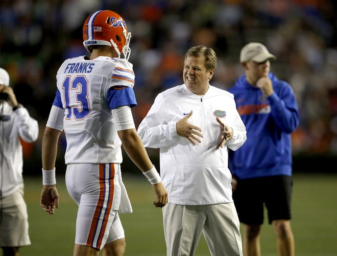 Florida head coach Jim McElwain gestures to quarterback Feleipe Franks (13) after a poor throw by Franks during the Orange and Blue Debut, the annual spring football game, at Ben Hill Griffin Stadium in Gainesville on April 7. [Brad McClenny / Gatehouse Media]
