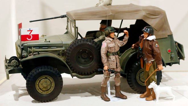 A Gen. George Patton G.I. Joe action figure, right, and other G.I. Joes are seen Jan. 31, 2014, in a display at the New York State Military Museum in Saratoga Springs, N.Y. (Associated Press)