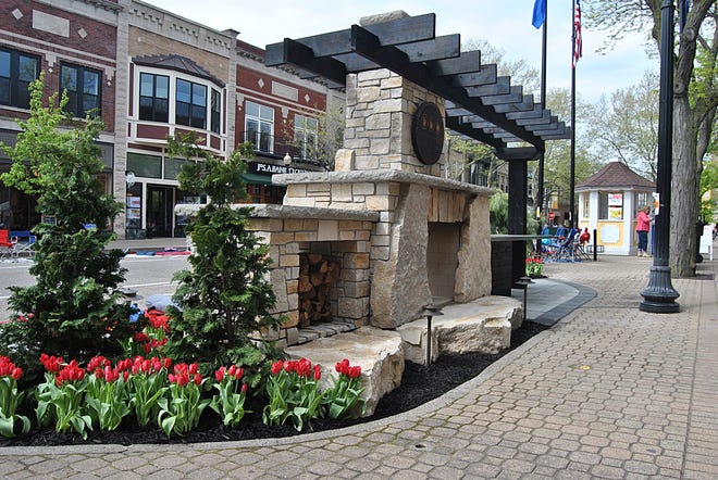 The pop-up gardens are back again in downtown Holland with this one located along 8th Street in front of Francesca's. This garden was constructed by Hollandia Outdoors and features a grill and fireplace. [Austin Metz/Sentinel Staff]