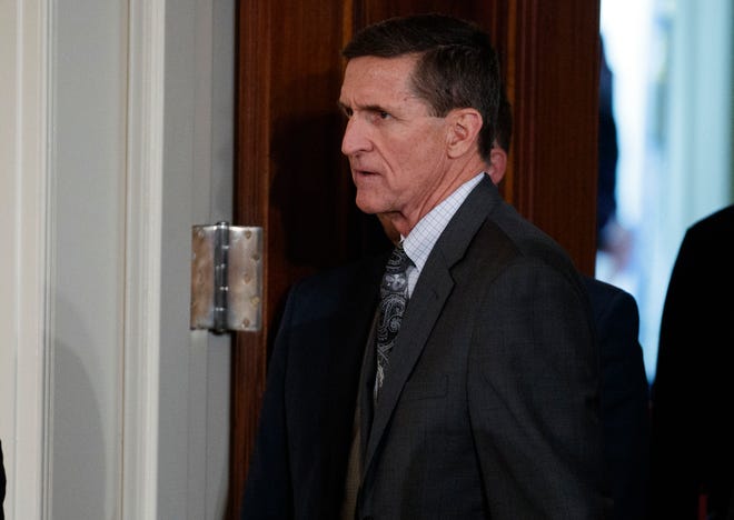 FILE - In this Feb. 13, 2017 file photo, Mike Flynn arrives for a news conference in the East Room of the White House in Washington. Targeted in widening investigations of his foreign entanglements, President Donald Trump’s former national security adviser, Michael Flynn, is at odds with his former Turkish client over two unusual payments totaling $80,000 that Flynn’s firm sent back last year to the client. The disagreement points to inconsistencies in Flynn’s accounts to the U.S. government about his work for foreign interests.(AP Photo/Evan Vucci, File)