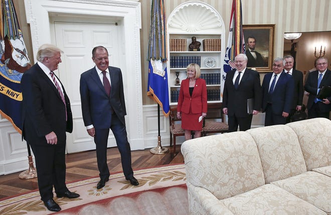 U.S. President Donald Trump meets with Russian Foreign Minister Sergey Lavrov, second left, at the White House in Washington, Wednesday, May 10, 2017. Trump on Wednesday welcomed Vladimir Putin's top diplomat to the White House for Trump's highest level face-to-face contact with a Russian government official since he took office in January. Fourth from right is Russian Ambassador to the U.S. Sergei Kislyak. (Russian Foreign Ministry Photo via AP)