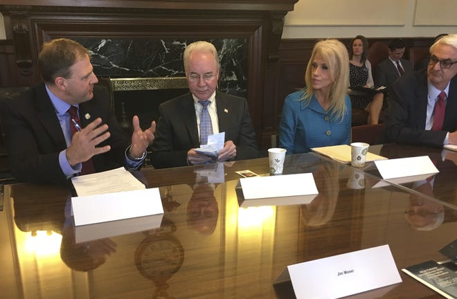 New Hampshire Gov. Chris Sununu, from left, U.S. Secretary of Health and Human Services Tom Price, second from left, Kellyanne Conway, an advisor to President Donald Trump, and Jeff Meyers, commissioner of New Hampshire's Department of Health and Human Services, take their seats on Wednesday in the executive council chamber in Concord, N.H., prior to a closed-door meeting to gather information on the state's opioid crisis. [AP Photo/Kathleen Ronayne]