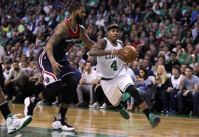 Isaiah Thomas drives past the Wizards' Markieff Morris in Game Five on Wednesday in Boston. The Celtics went up 3-2 in the series with a chance to close it out in Washington on Friday.