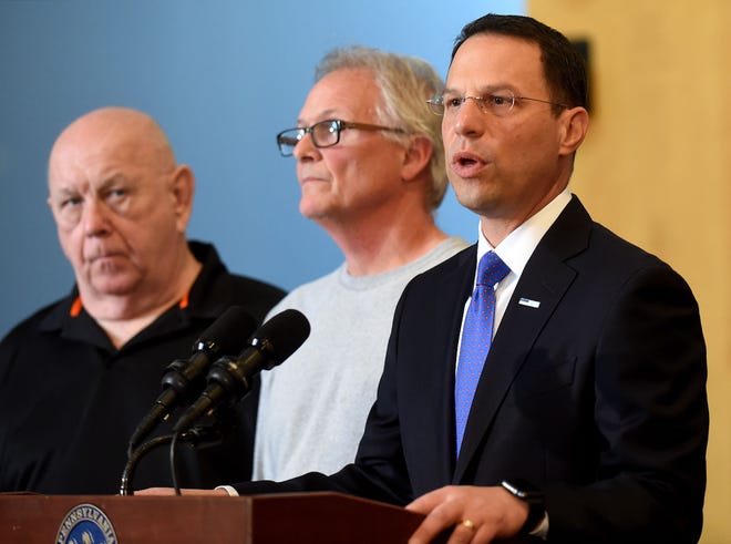 Attorney General Josh Shapiro speaks on behalf of Robert Kuzcynski of Bensalem, left, and Tom Wakeley of Lower Southampton, at a press conference on Tuesday, May 9, 2017, at the Bensalem municipal building. Kuczynski and Wakeley said they paid Gregory Bertino, owner of Robert's Motor Mart, to get new tools or have him repair old ones, but he did not do the work.