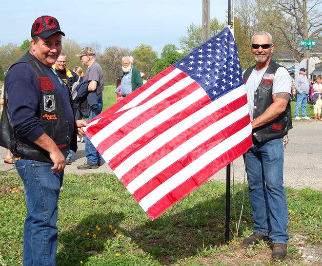 Vietnam Veterans Rusty Good and Claude Price prepare to raise the flag, signaling the start of last year's Osseo Heritage Day festivities. NANCY HASTINGS PHOTO