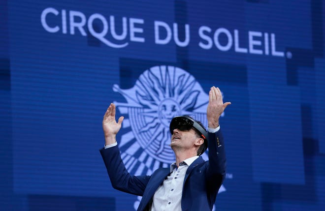 A member of Cirque du Soleil demonstrates use of Microsoft's HoloLens device in helping to virtually design a set at the Microsoft Build 2017 developers conference, Thursday, May 11, 2017, in Seattle. (AP Photo/Elaine Thompson)