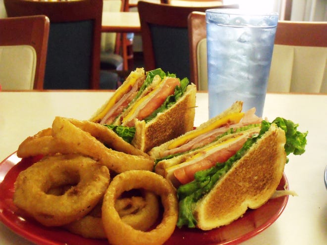 Christine's Ham & Turkey Club is a large sandwich topped with a BLT, for $6.99, and customers can choose their favorite bread. A combo, which includes fries or onion rings and a drink, is $8.99. [Photo by Alison Minard]