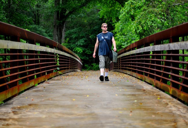 An OnlineAthens.com/Athens Banner-Herald file photo shows a pedestrian bridge across the North Oconee River near downtown Athens that is part of a greenway network that remains under development in the county. Greenway projects are included in a list of proposals for funding with a proposed 1 percent local sales tax that will be the subject of a November referendum. (File photo / OnlineAthens.com/Athens Banner-Herald)