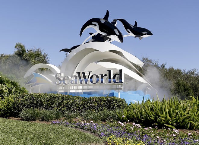 FILE - This Tuesday, Jan. 31, 2017, file photo, shows the entrance to SeaWorld, in Orlando, Fla. SeaWorld Entertainment Inc. reports earnings, Tuesday, May 9, 2017. (AP Photo/John Raoux)