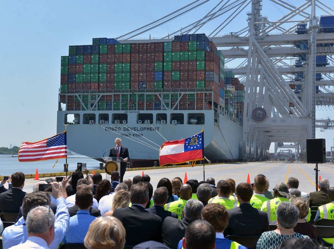Six container cranes work in the background as Gov. Nathan Deal welcomes the COSCO Development to Savannah in a ceremony at the Georgia Ports Authority’s Garden City dock. The cranes will handle 5,500 containers, a record for Georgia’s Ports. (Steve Bisson/Savannah Morning News)