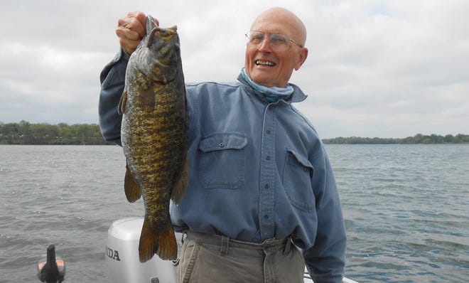 Legendary angler Ned Kehde, of Lawrence, hoists up a 6-pound, 6-ounce smallmouth bass he caught in April 2016 while fishing a 2 1/2-inch Z-Man ZinkerZ in green-pumpkin-goby attached to a blue 1/16-ounce Gopher Tackle Mushroom Head jig. Kehde said the biggest largemouth he has ever caught on it weighed 6 pounds, 10 ounces, though he didn’t get a picture of that catch on April 19, 2013. Both fish were caught in Kansas. (SUBMITTED)