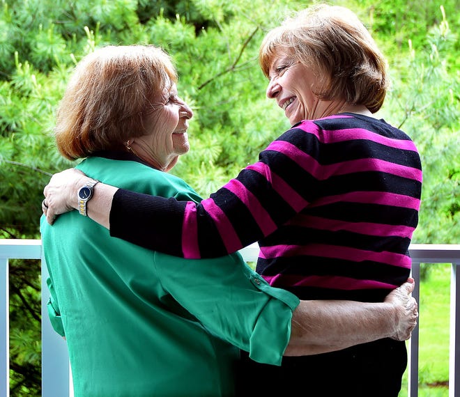 Holocaust survivor Terry Herskovits (left), of Evesham, and her daughter, Judith Wizmur, of Mount Laurel, share a tender moment.