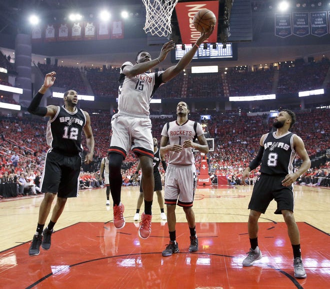 Houston Rockets center Clint Capela (15) shoots as San Antonio Spurs forward LaMarcus Aldridge (12) and guard Patty Mills (8) watch during the first half in Game 6 of an NBA basketball second-round playoff series, Thursday, May 11, 2017, in Houston. (AP Photo/Eric Christian Smith)