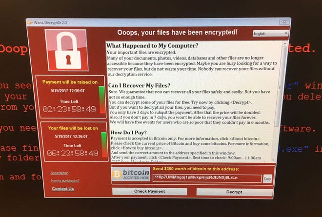 A tweeted image of a computer screen at Greater Preston CCG, part of Britain's National Health Service, shows the malware message in the cyberattack that has hit computers worldwide. [@fendifille via AP]